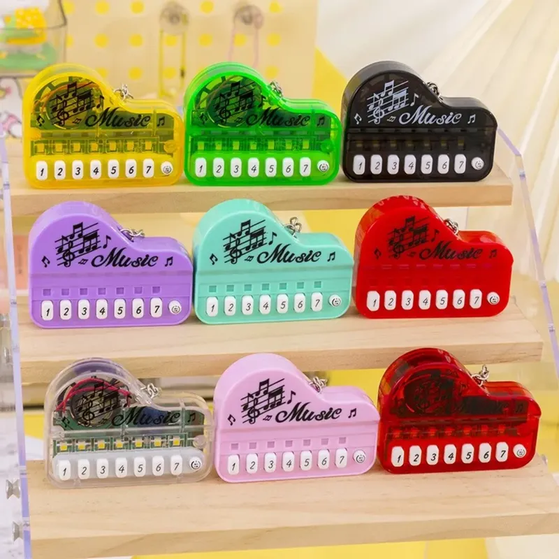 Tragbarer Mini-Schlüsselanhänger mit elektronischer Tastatur, Musikinstrumentenspielzeug – kompakter Reise-Klavier-Schlüsselanhänger für Musikliebhaber