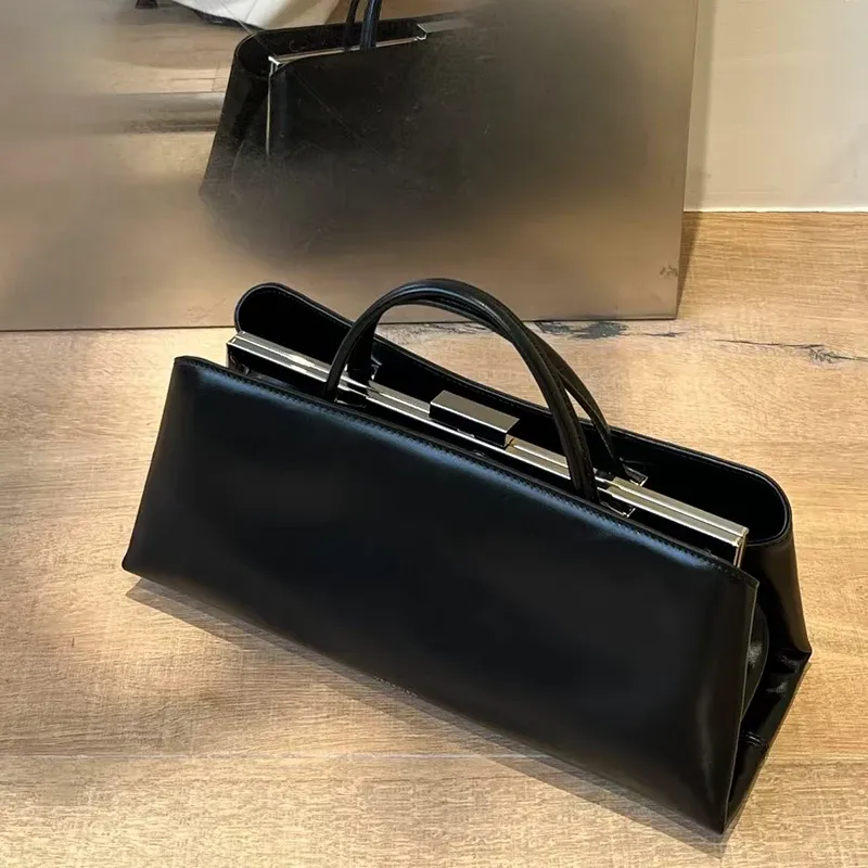 Luxuriöse Lederhandtasche für Damen, High-End-Hardware, magnetisches Saugclip-Design, elegante, minimalistische Schulter- und Unterarmtasche, Geldbörse