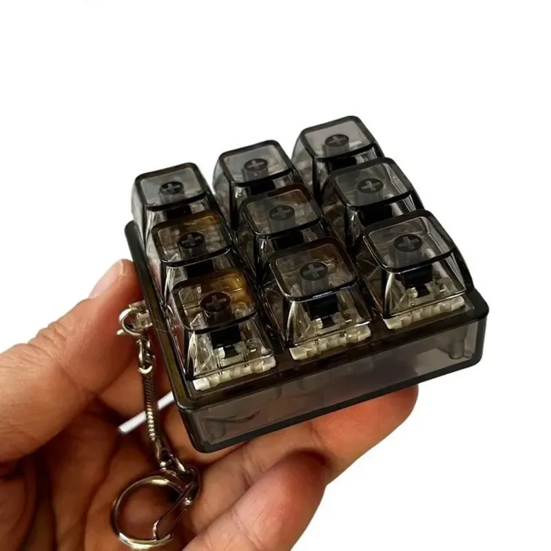 Neuer Kreativer Transparenter Schlüsselanhänger mit Beleuchtung Stressabbau Mechanische Tastatur Geschenk-Tasten Schlüsselring