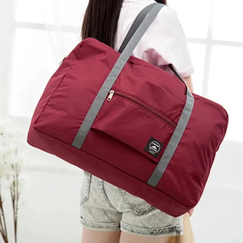 Neue Nylon Faltbare Reisetaschen Unisex Große Kapazität Schulter Tasche Gepäck Frauen Wasserdichte Handtaschen Reisetaschen